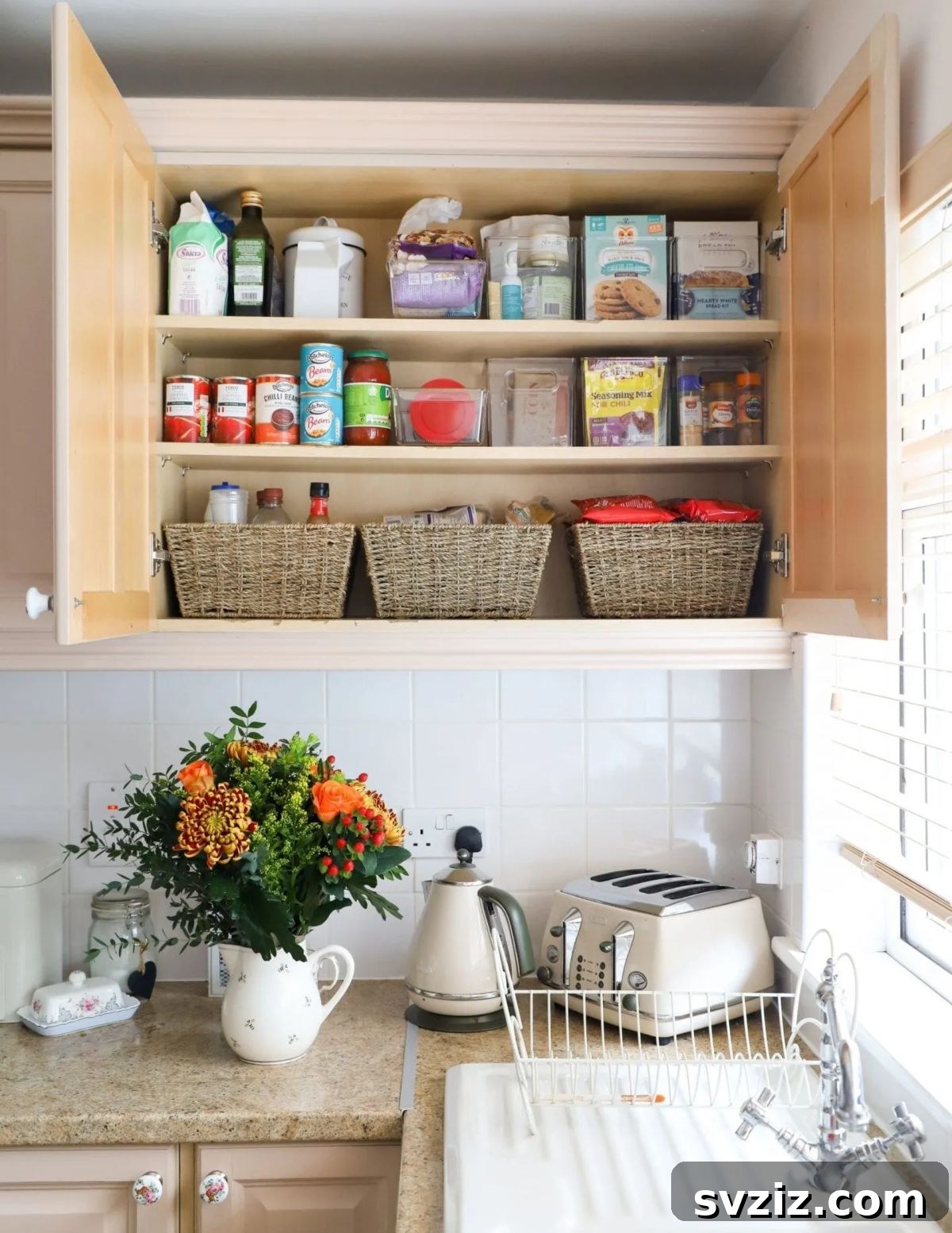21 Genius Tricks to Tame Kitchen Clutter 13 Kitchen pantry shelves organized with various woven and wire baskets