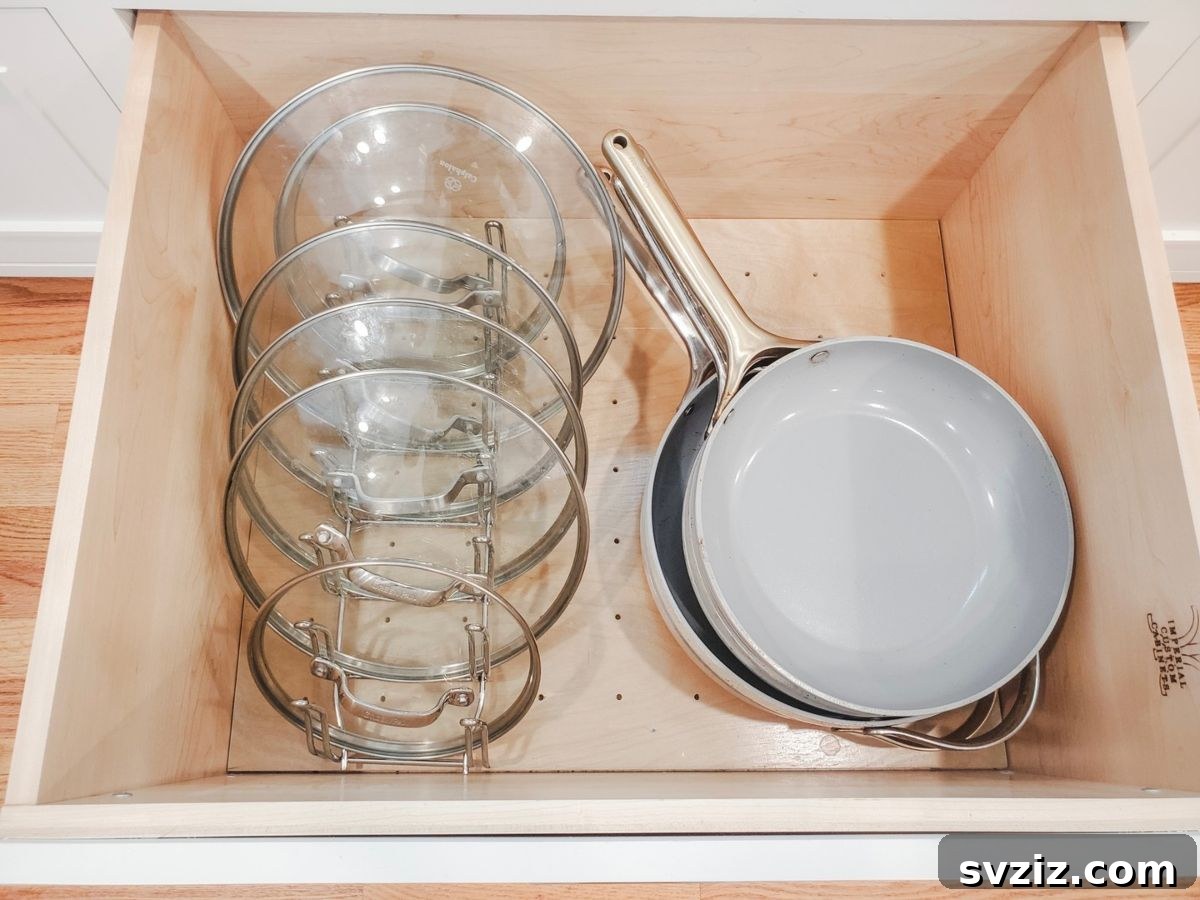 21 Genius Tricks to Tame Kitchen Clutter 18 Kitchen cabinet with a pan lid organizer holding lids vertically