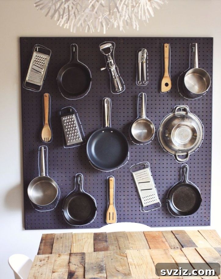 21 Genius Tricks to Tame Kitchen Clutter 3 Organized kitchen wall with pegboard storage for utensils