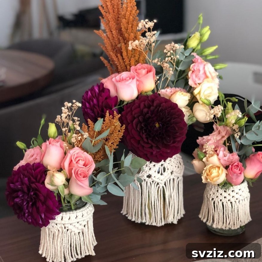 21 Breathtaking Boho Wedding Centerpiece Designs 11 Boho Tassel Vases with Vibrant Floral Arrangements