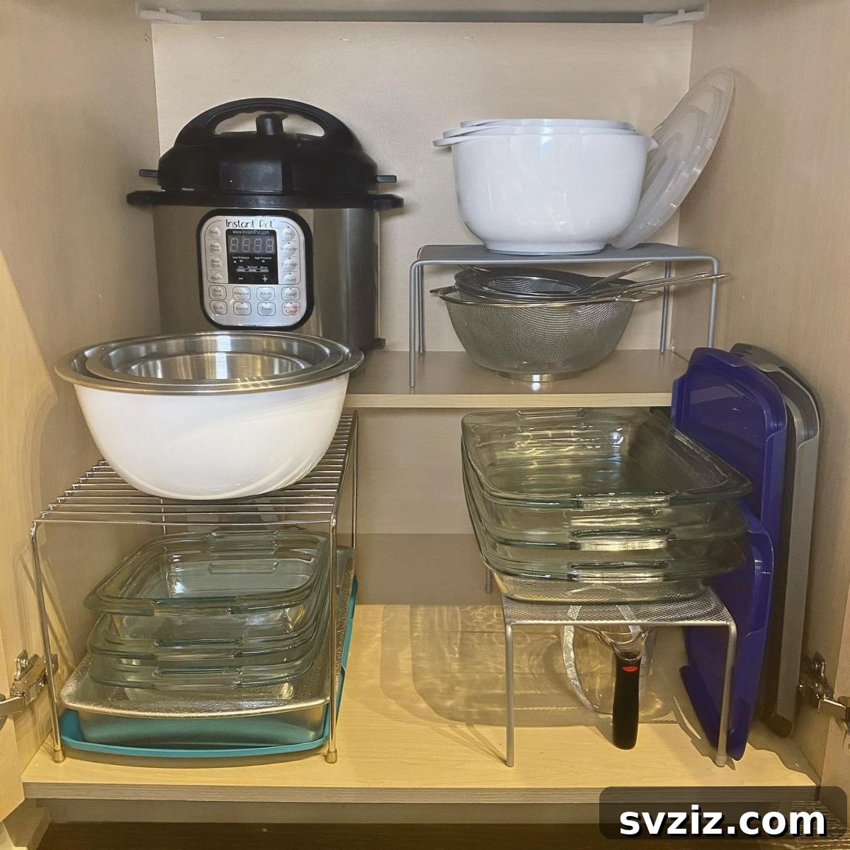 25 Brilliant Storage Hacks for Tiny Kitchens 21 Kitchen cabinet with shelf risers for stacked dishes