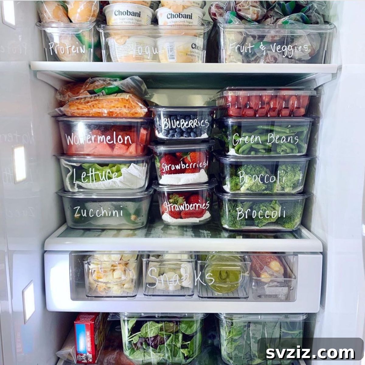 A refrigerator interior organized with clear, stackable food storage containers, maximizing space and visibility.