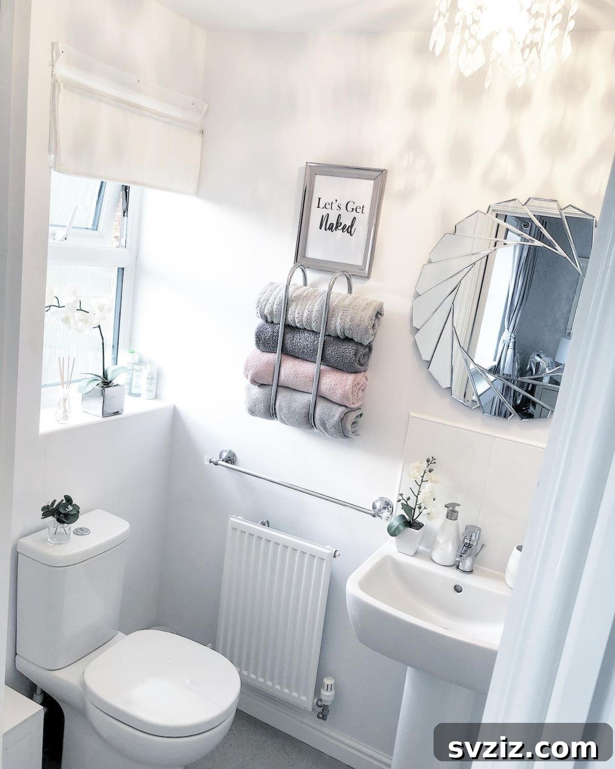 Neatly rolled bath towels stored on a shelf, demonstrating space-saving and aesthetically pleasing organization.