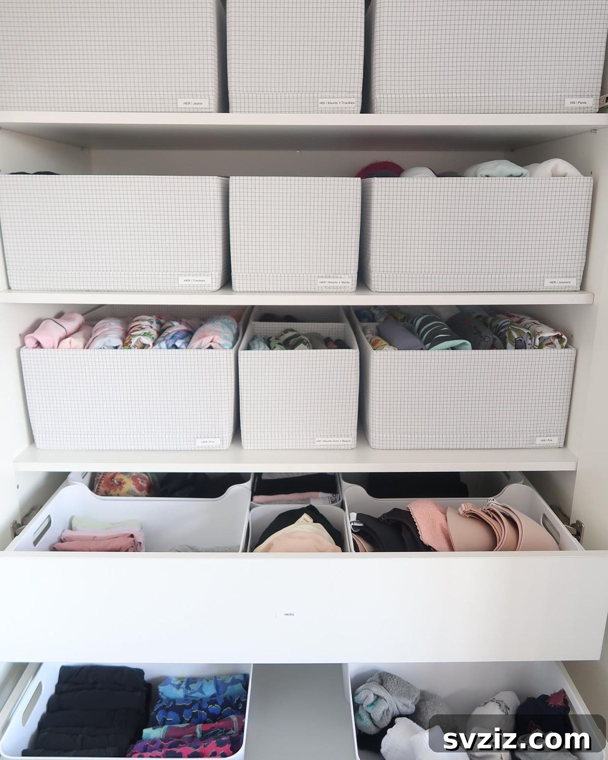 Fabric storage cases neatly arranged on wardrobe shelves, providing tidy and flexible storage for clothing.