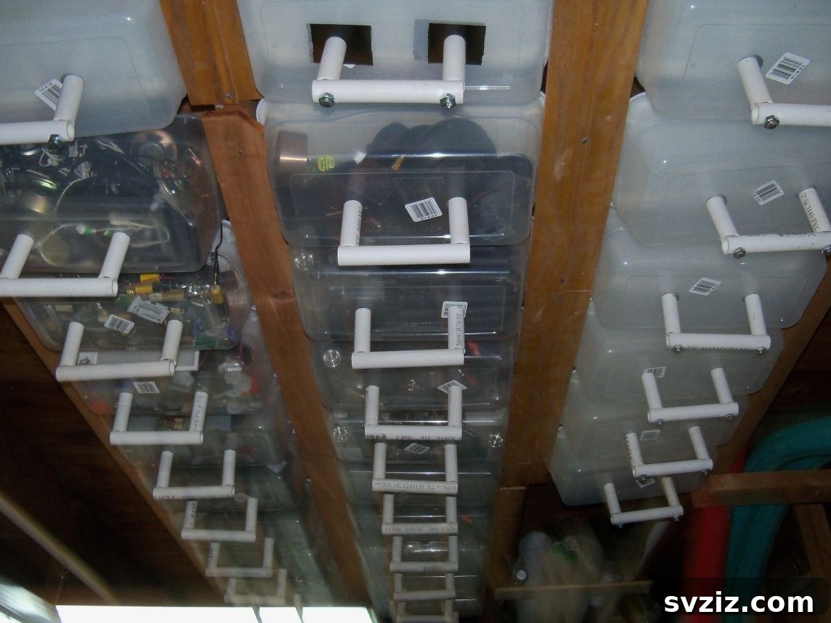 Transform Your Attic: Clever Organizing Secrets 19 Attic ceiling storage solution with sliding plastic tubs on rails