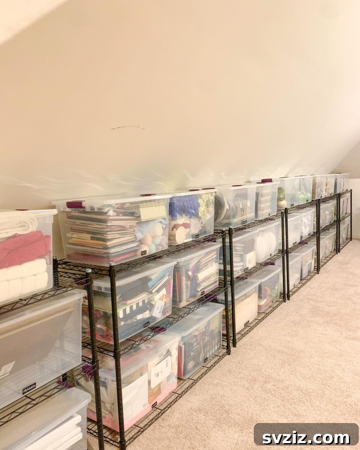 Transform Your Attic: Clever Organizing Secrets 9 Attic with containers neatly lined up along the wall for easy access