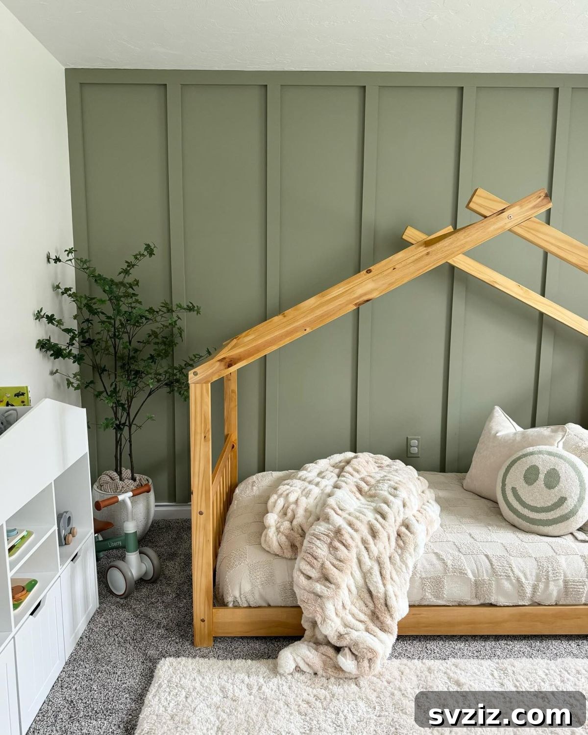 Simple and natural boy's bedroom with floor bed and greenery