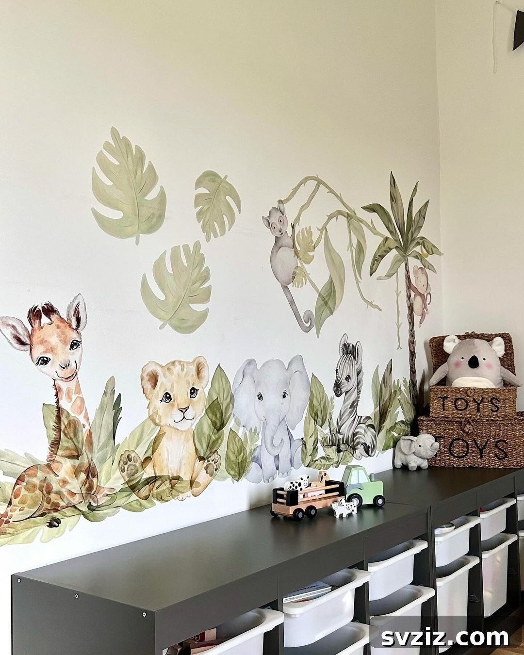 Classic safari themed boy's bedroom with animal wall decals