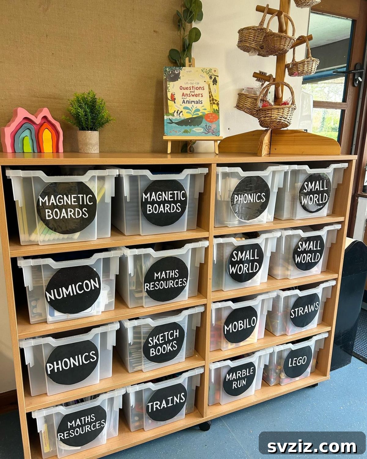 Colorful bins with large, clear labels for classroom organization