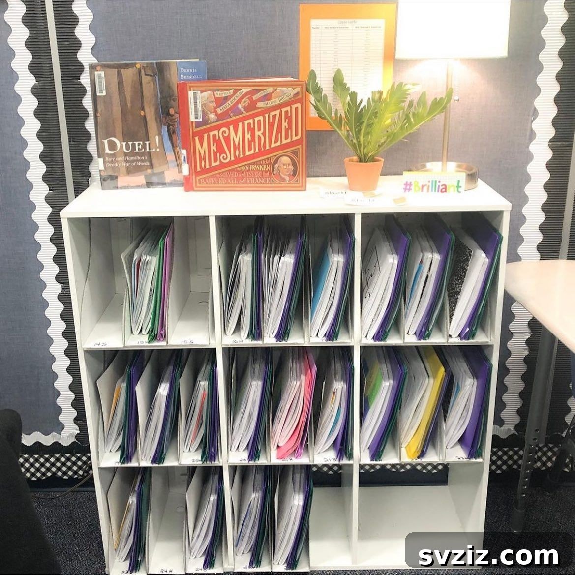Classroom storage boxes turned on their sides to fit shelf space