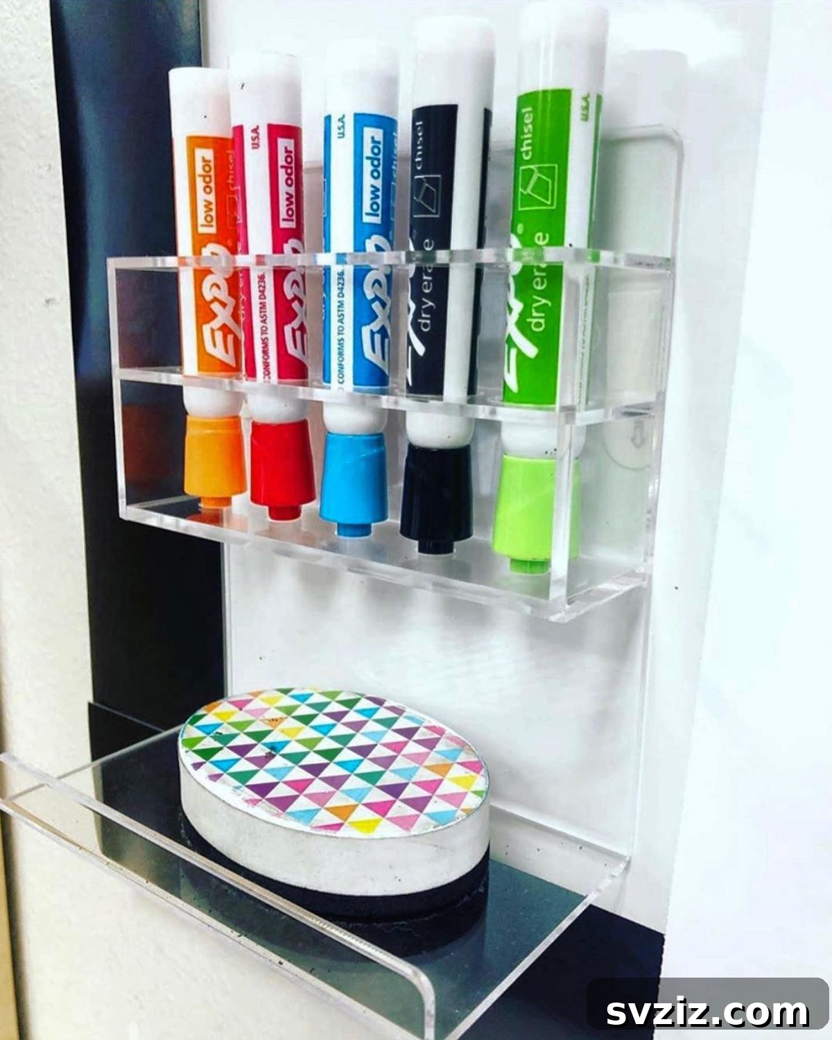 Hanging marker organizer next to a whiteboard in a classroom
