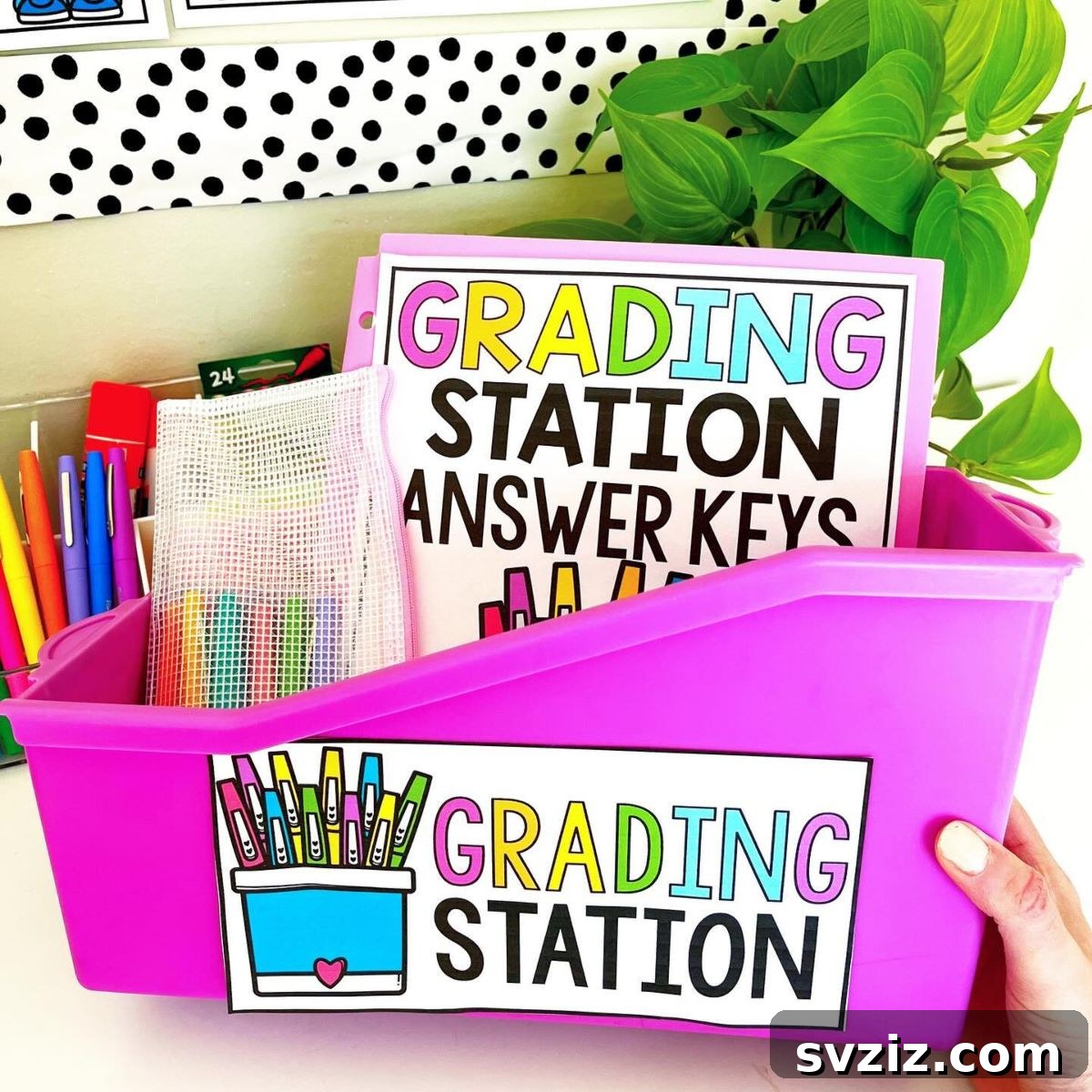 Organized classroom grading station with folders and pens