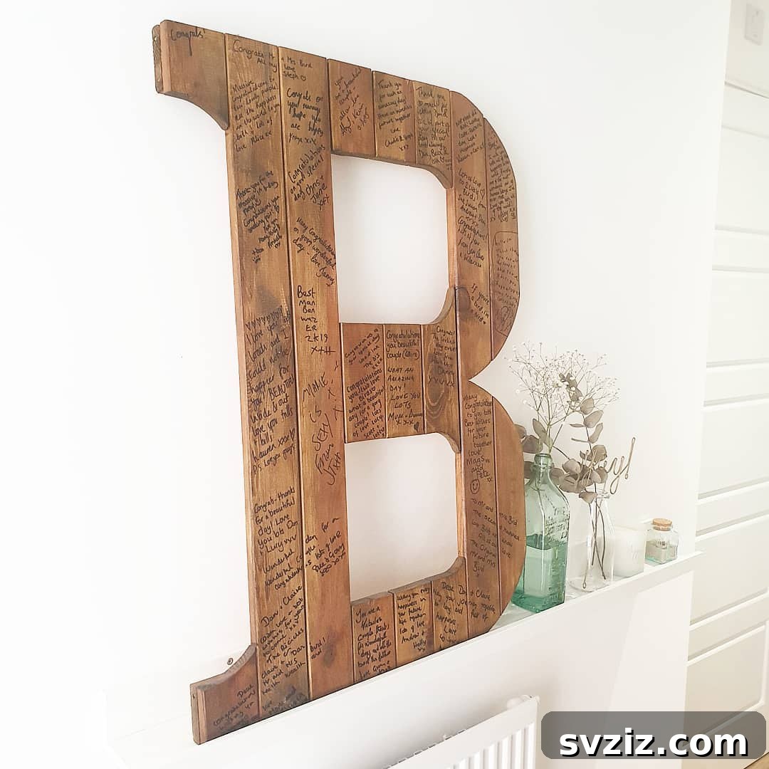 Large wooden initial letter for wedding guests to sign