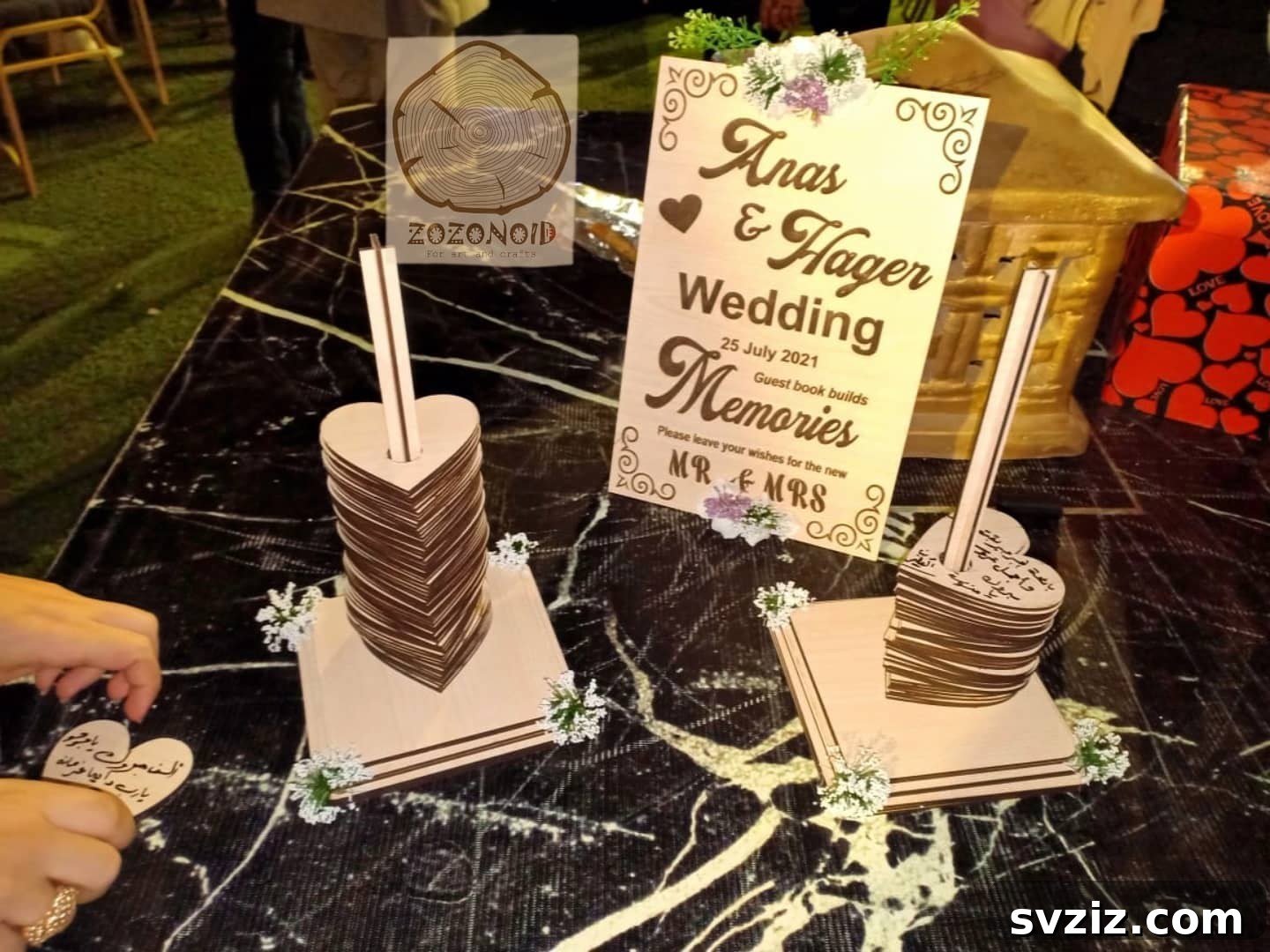 Stacked wooden hearts guest book display