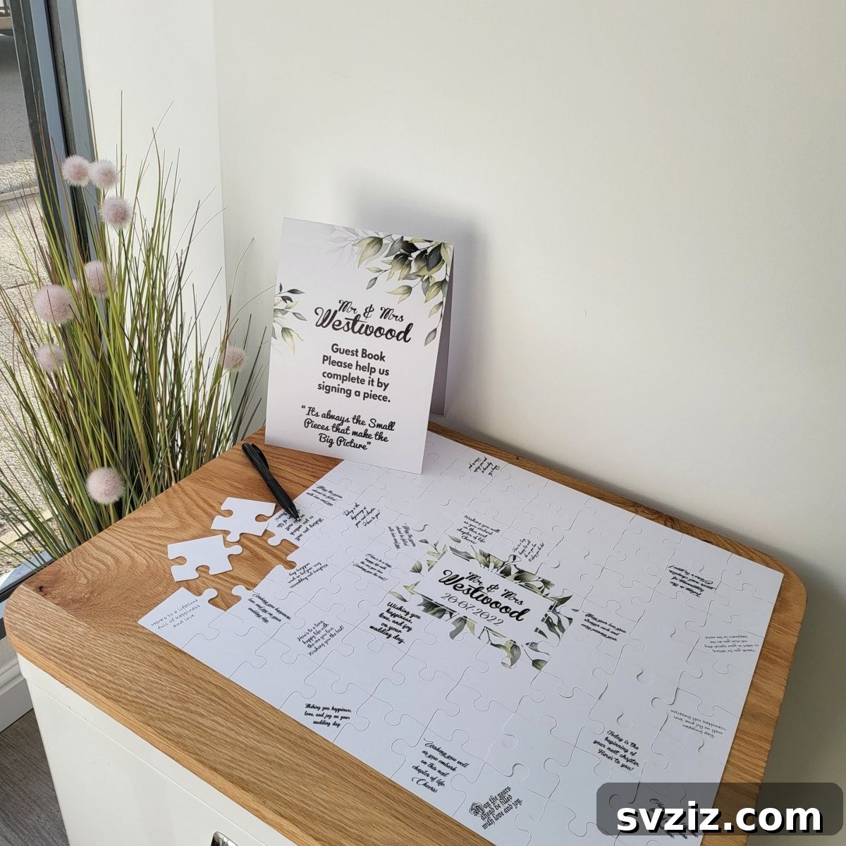 Wedding guest book made from puzzle pieces signed by guests