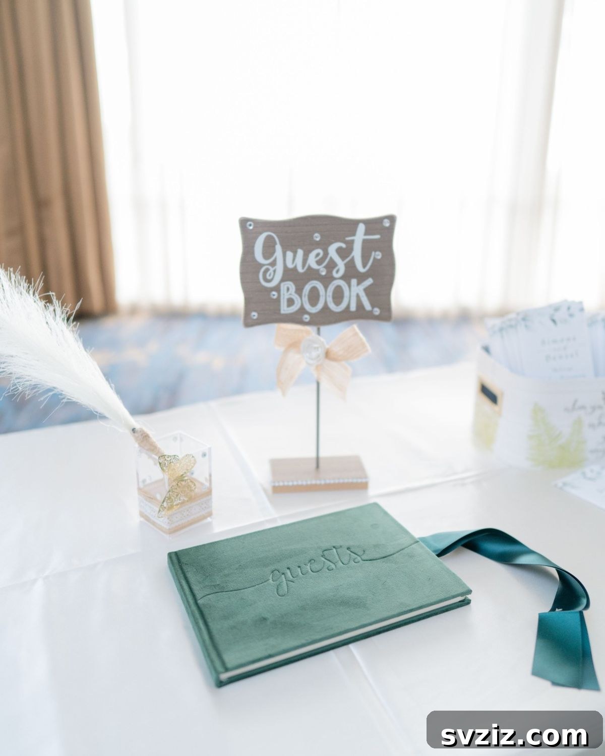 Traditional guest book with a feathered quill and inkwell