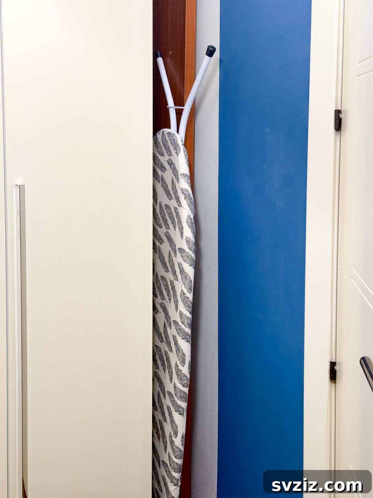 Hide the Ironing Board Behind the Door for a Clutter-Free Space