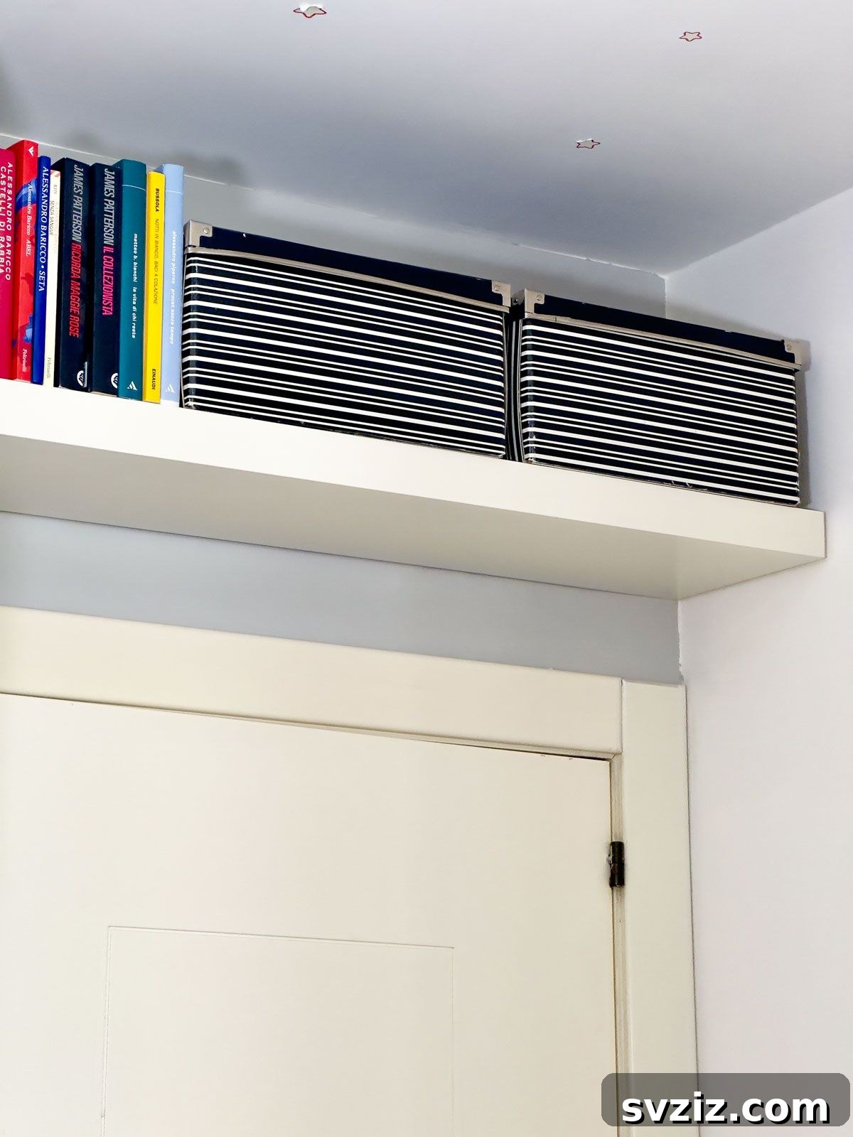 Vertical Storage Space Above the Doors for Tiny Home Organization