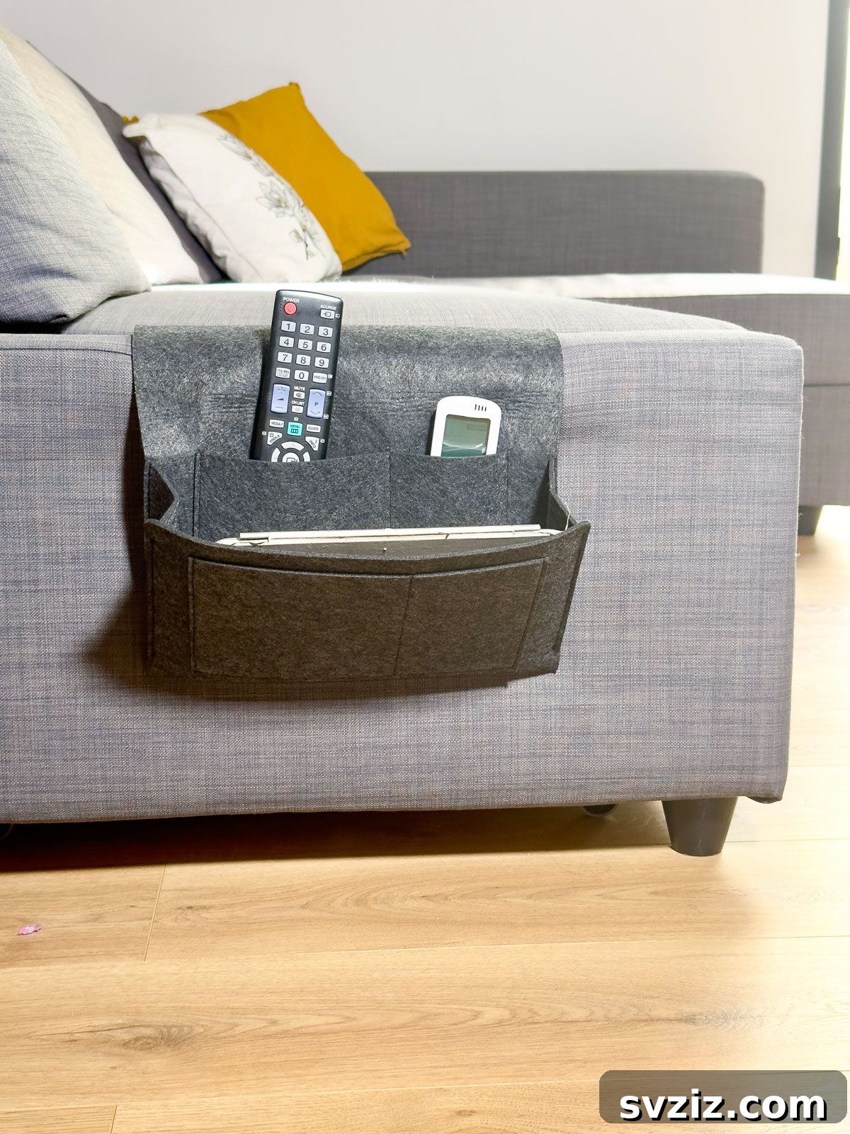 Store Living Room Items on a Sofa Organizer for a Tidy Tiny Home