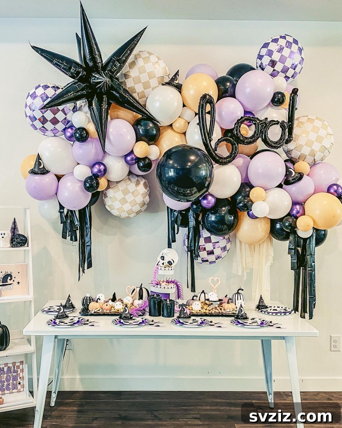 31 Terrifying Halloween Bash Concepts 13 Halloween balloon garland in purple, black, white, and peach