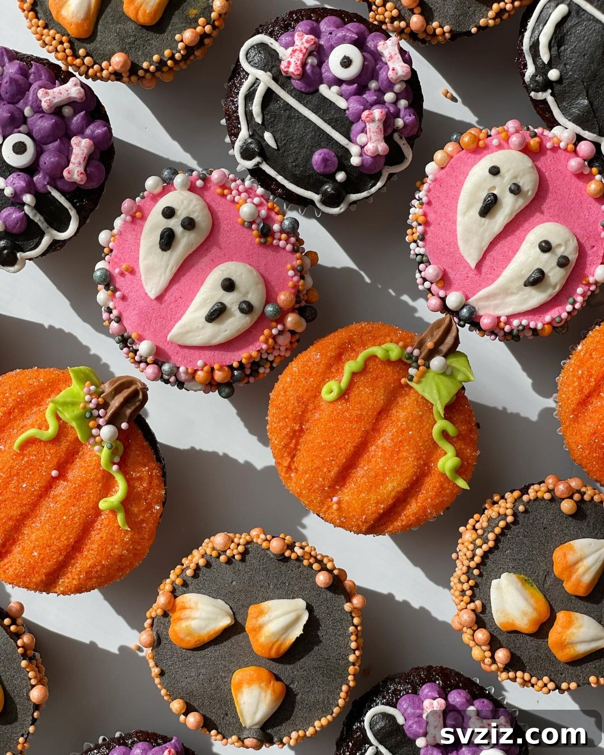31 Terrifying Halloween Bash Concepts 23 Decorated Halloween cupcakes shaped like ghosts, pumpkins, and witch hats