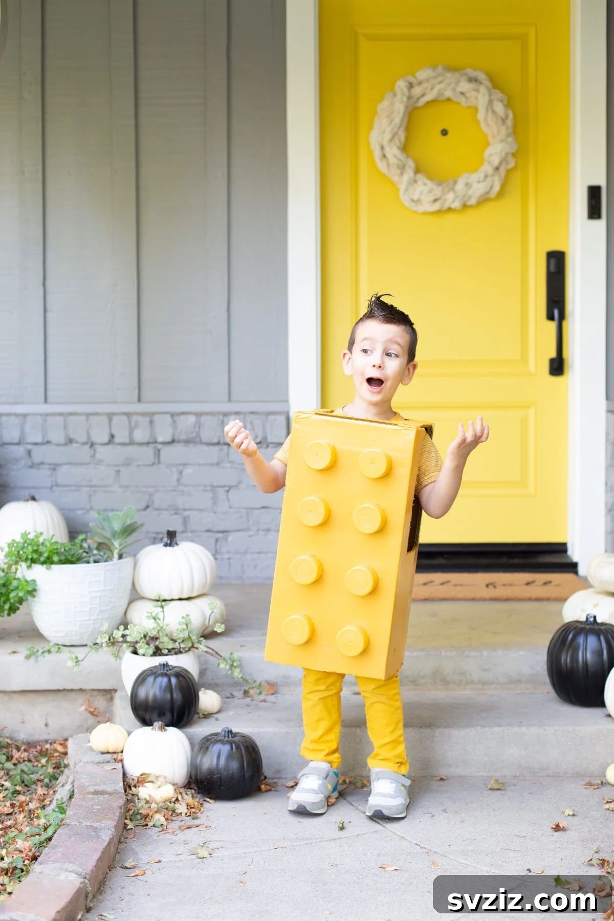 31 Terrifying Halloween Bash Concepts 29 Kids dressed in a DIY Lego costume for a Halloween contest
