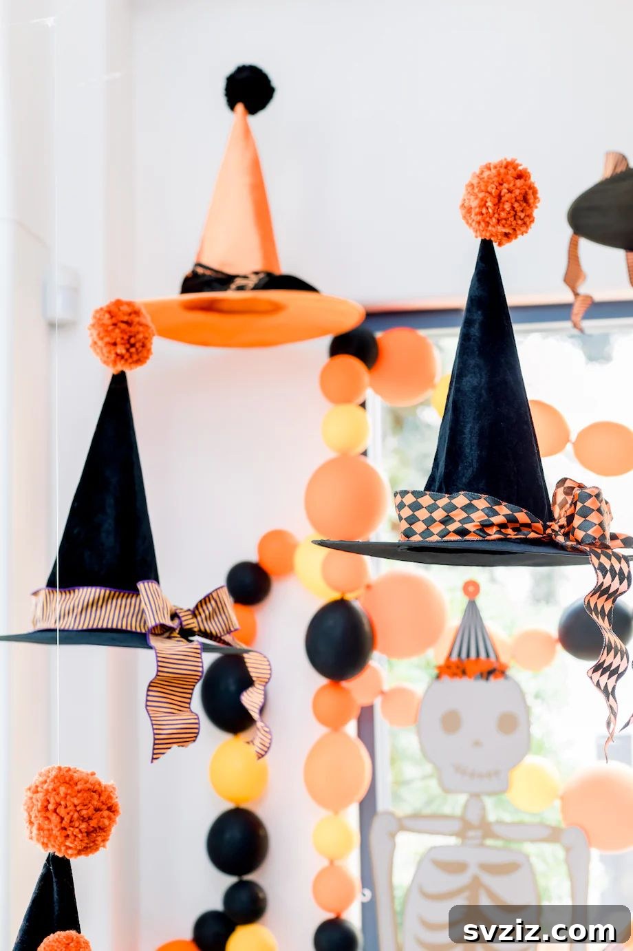 31 Terrifying Halloween Bash Concepts 8 Hanging DIY witch hat decor