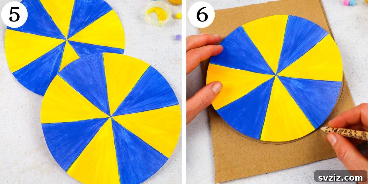 Cardboard core for paper spinner being cut after tracing decorated paper circle