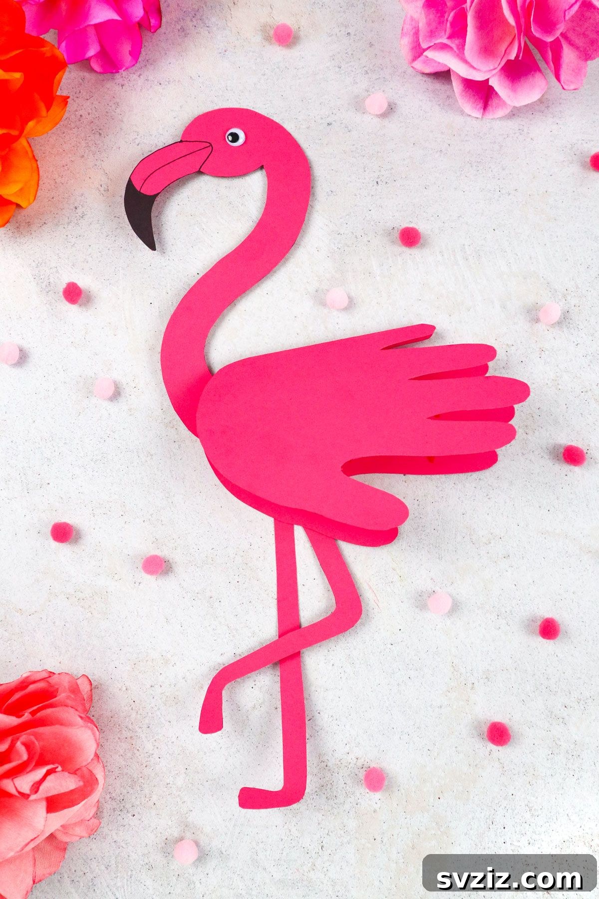 Flamingo Handprint Delight 2 Beautiful pink handprint flamingo craft made with paper and googly eyes, perfect for kids and gifts.