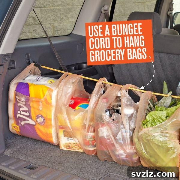 20 Effortless Car Organization Tips 21 Bungee cord used in a car trunk to secure grocery bags and prevent them from spilling.