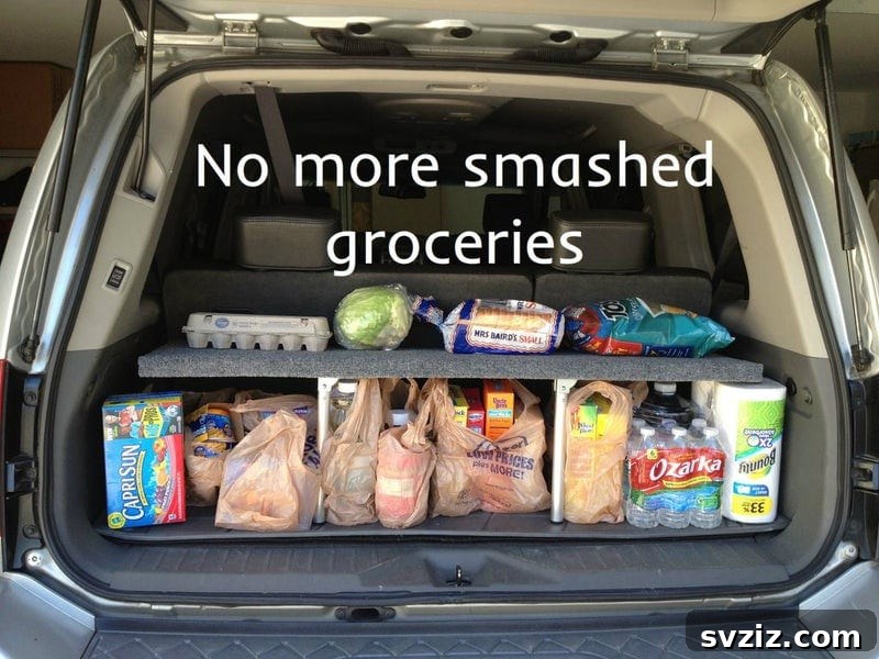 20 Effortless Car Organization Tips 5 Custom-built pop-up shelf in a car trunk for organized storage and protection of groceries.