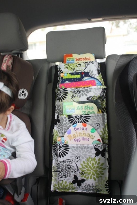 20 Effortless Car Organization Tips 6 Fabric car organizer for children's books, keeping them tidy and accessible during travel.