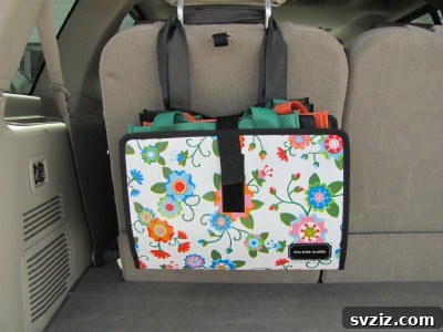 20 Effortless Car Organization Tips 10 Organized car trunk using a 'Tote Buddy' with labeled pouches for various items.