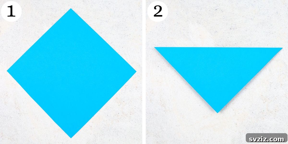 fold origami paper diagonally to make a triangle, origami base step