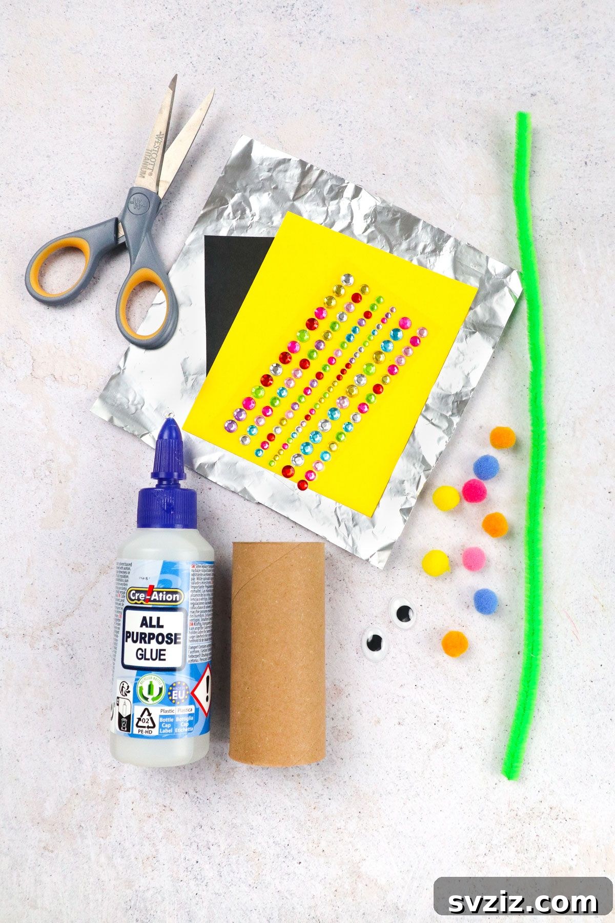 Craft supplies laid out for Robot Toilet Paper Craft