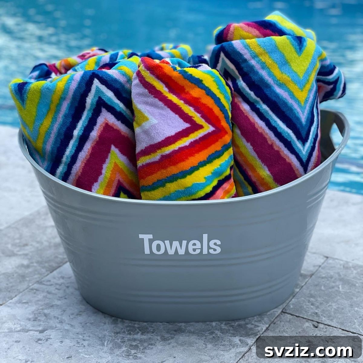 23 Brilliant Towel Storage Ideas to Transform Your Bathroom 23 Colorful Beach Towels in Metal Buckets