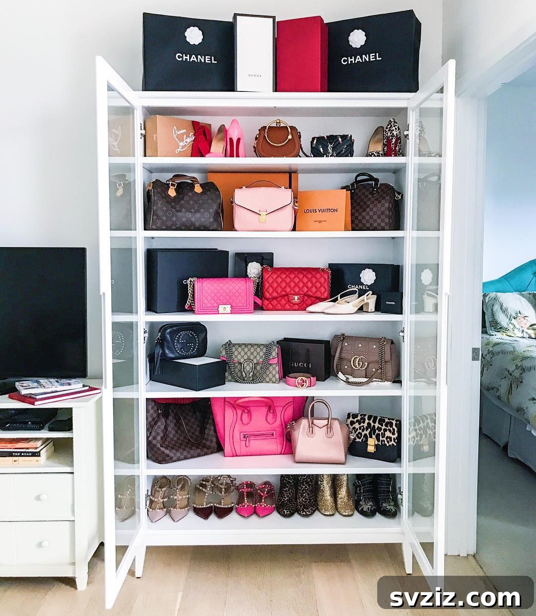 IKEA glass door cabinet showcasing handbags and accessories