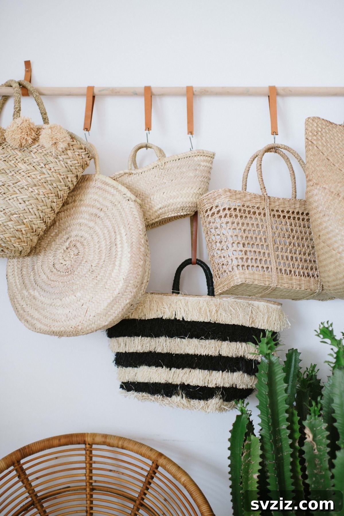 DIY hanging bag rack made with leather ties and a wooden dowel