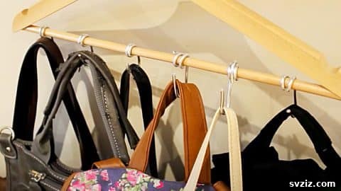 DIY coat hanger repurposed into a multi-purse holder