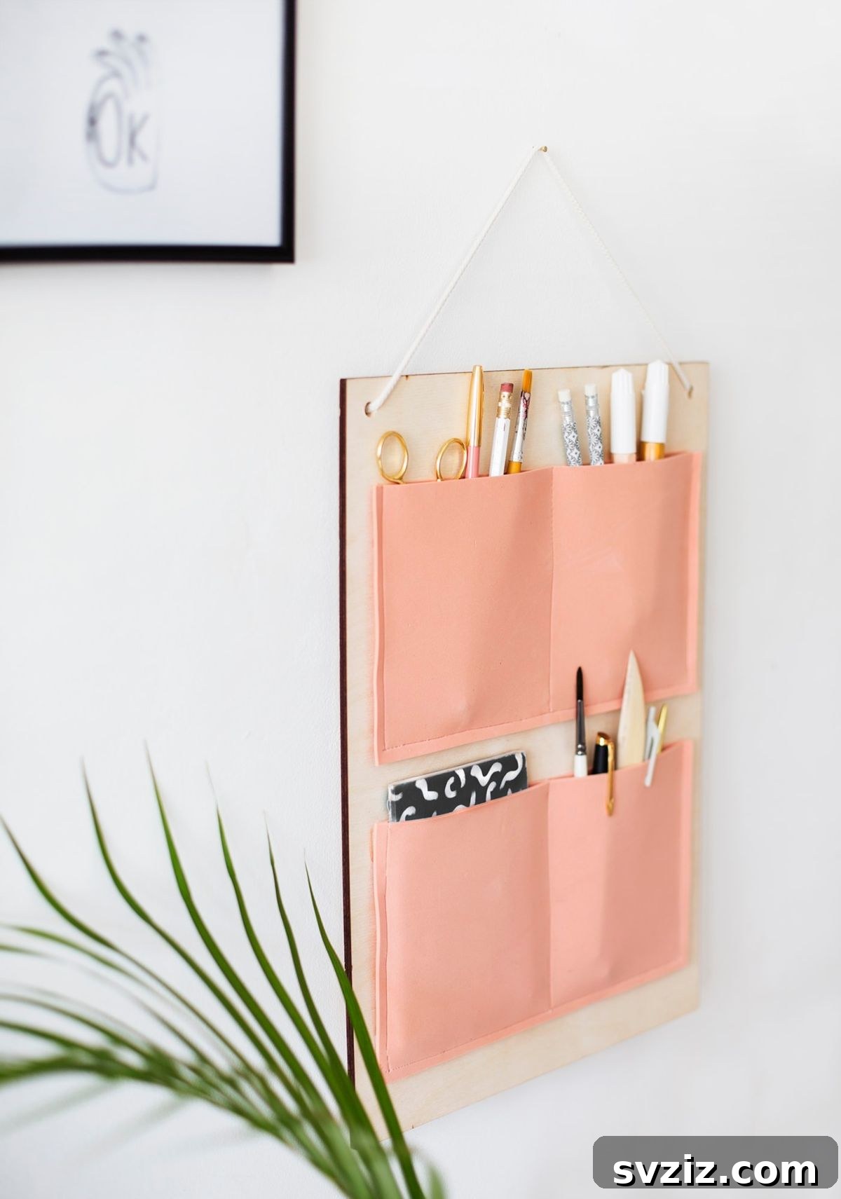 17 Clever DIY Wall Organizers to Conquer Clutter 4 Stylish DIY fabric pocket organizer for stationery and small items