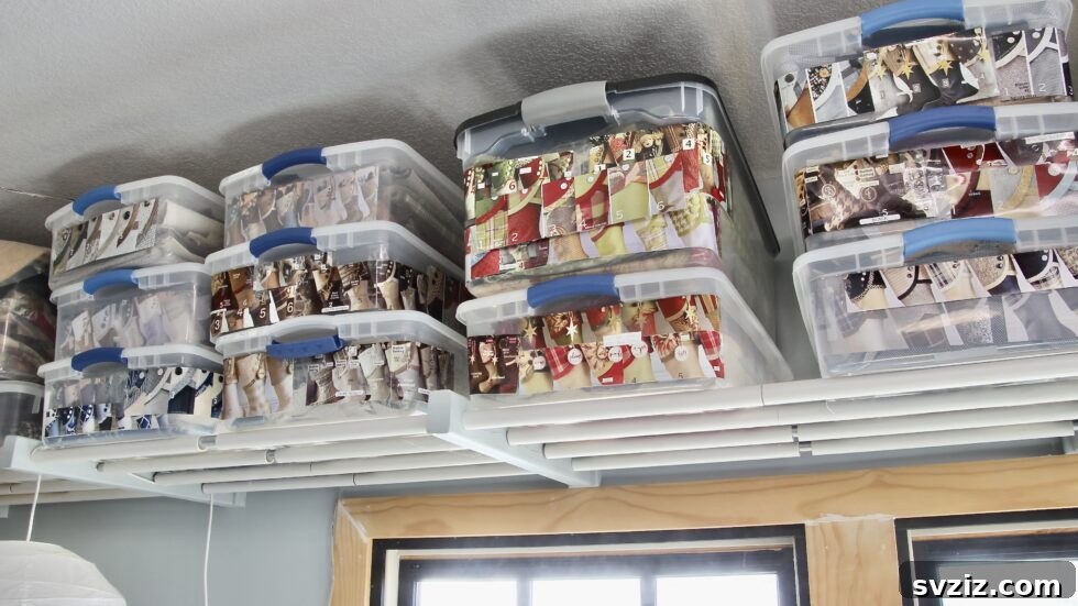 27 Smart Solutions for Organizing Clutter 11 Overhead Garage Storage - A garage with items stored efficiently on overhead racks, utilizing vertical space for boxes and larger household goods.