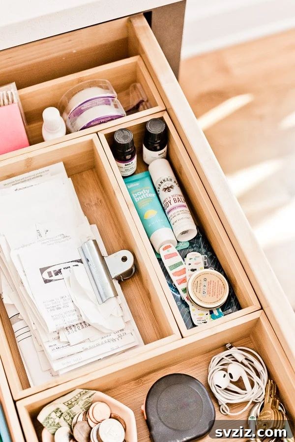27 Smart Solutions for Organizing Clutter 3 Junk Drawer Compartments - An organized drawer with small items neatly separated into individual compartments, showcasing a tidy storage solution.