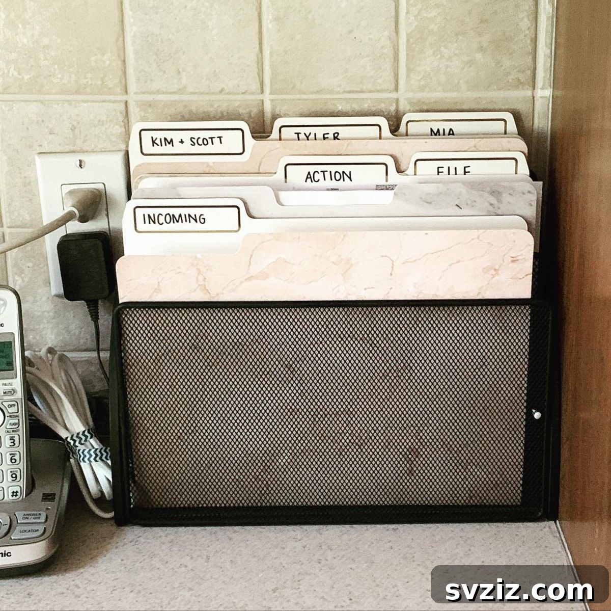 27 Smart Solutions for Organizing Clutter 23 File Paper Clutter - A sleek filing system with labeled folders, demonstrating an efficient way to organize various documents like mail, bills, and school papers.
