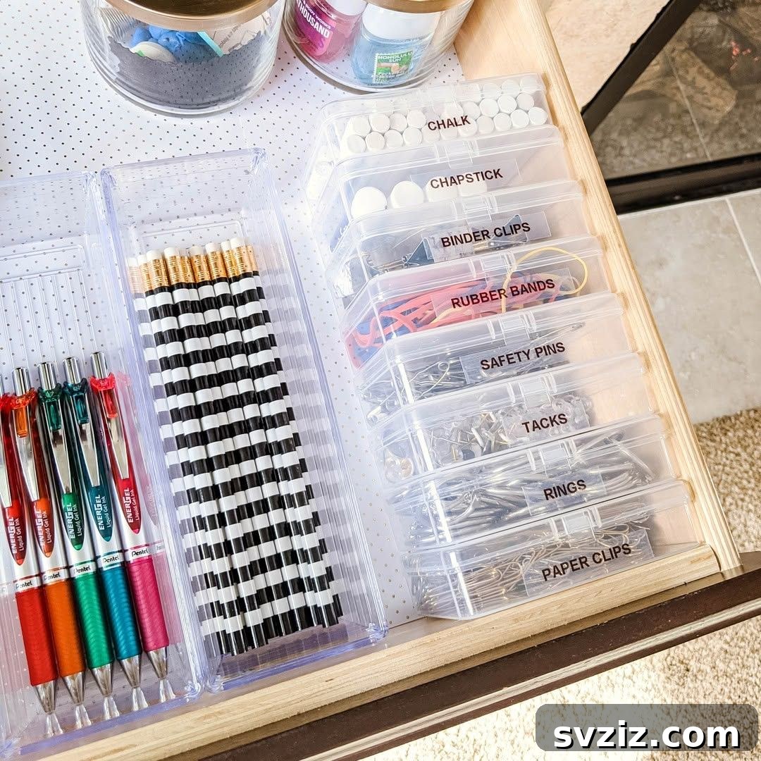 27 Smart Solutions for Organizing Clutter 26 Plastic Containers - A junk drawer neatly organized with a variety of plastic containers of different sizes, holding small household items in their designated spots.