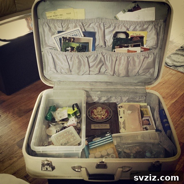 27 Smart Solutions for Organizing Clutter 28 Junk Suitcase - An open vintage suitcase repurposed as a storage solution, with various small items like buttons, ribbons, and tools neatly arranged in compartments, ready for crafting or repairs.