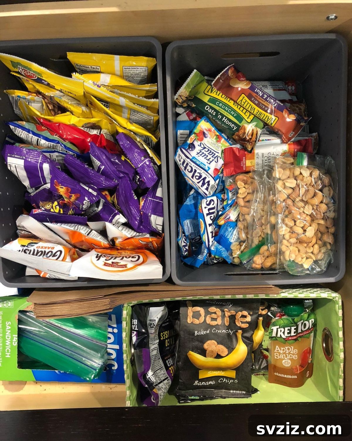 27 Smart Solutions for Organizing Clutter 6 Snack Food Drawer Bins - A pantry drawer organized with clear bins, each holding different types of snacks, making them easily accessible for kids.