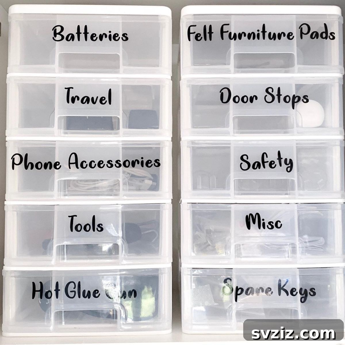 27 Smart Solutions for Organizing Clutter 10 Labeled Storage Containers - A set of clear plastic storage containers with white labels, neatly arranged on a shelf or inside a cabinet, showing organized miscellaneous items.