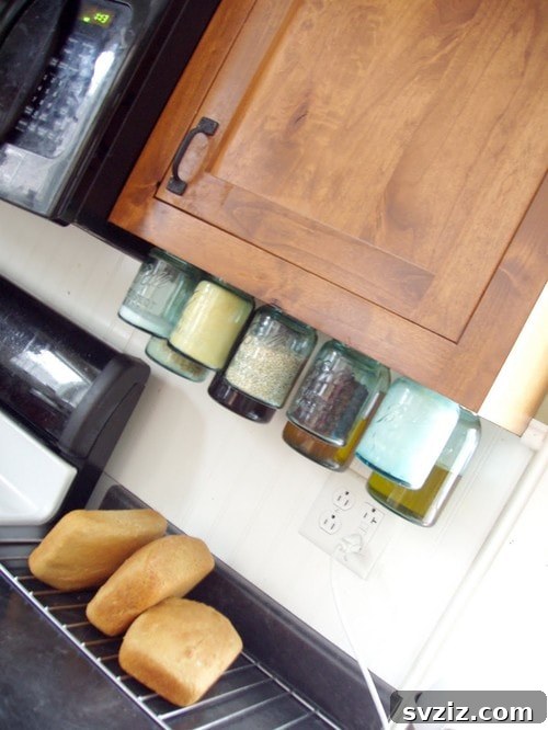 DIY mason jar lid storage system installed under a cabinet