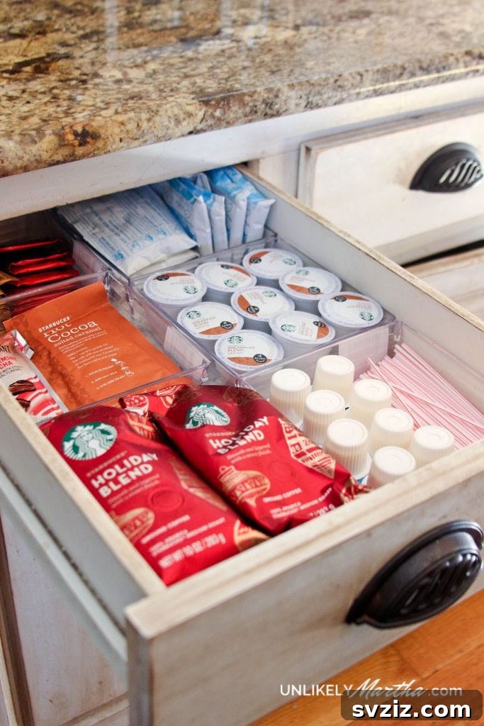 Organized kitchen drawer transformed into a coffee station with clear plastic boxes