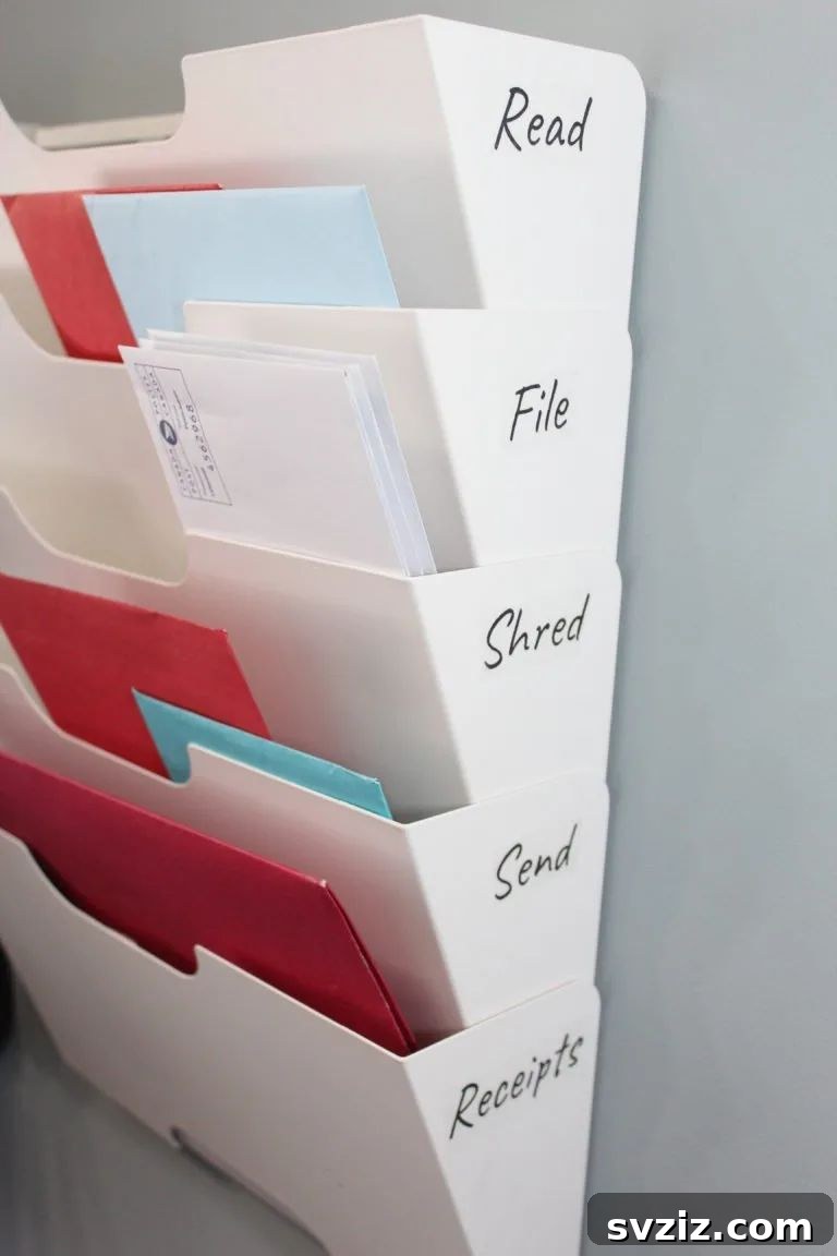 17 Genius School Office Organization Hacks 17 Wall-mounted file organizer for administrative papers, mail, and notes in a teacher's office.